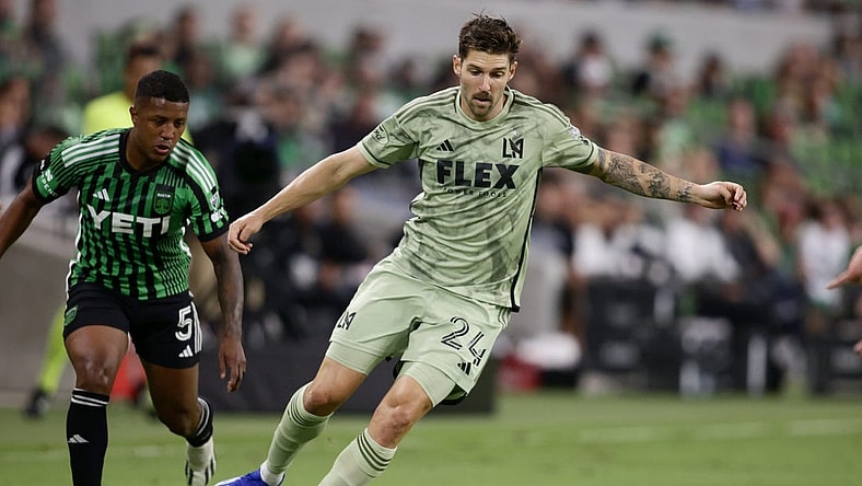 Oct 7, 2023; Austin, Texas, USA; Los Angeles FC midfielder Ryan Hollingshead (24) dribbles the ball during the first half at Q2 Stadium. Mandatory Credit: Erich Schlegel-USA TODAY Sports