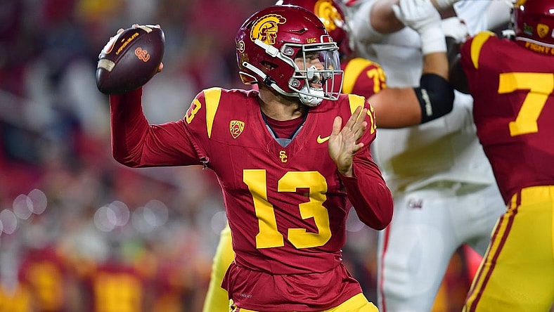 Oct 7, 2023; Los Angeles, California, USA; Southern California Trojans quarterback Caleb Williams (13) throws against the Arizona Wildcats during the first half at Los Angeles Memorial Coliseum. Mandatory Credit: Gary A. Vasquez-USA TODAY Sports