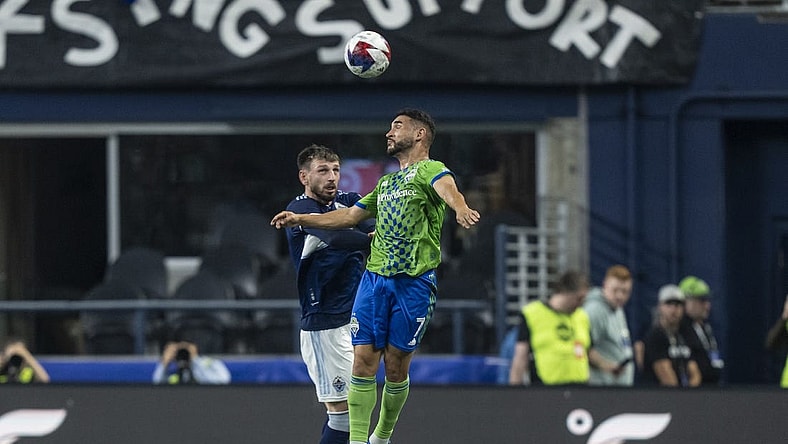 Oct 7, 2023; Seattle, Washington, USA; Seattle Sounders midfielder Cristian Roldan (7) and Vancouver Whitecaps defender Tristan Blackmon (6) go up for a header during the first half at Lumen Field. Mandatory Credit: Stephen Brashear-USA TODAY Sports