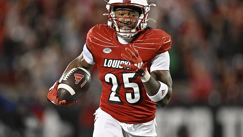 Oct 7, 2023; Louisville, Kentucky, USA;  Louisville Cardinals running back Jawhar Jordan (25) runs the ball to score a touchdown against the Notre Dame Fighting Irish during the second half at L&N Federal Credit Union Stadium. Louisville defeated Notre Dame 33-20. Mandatory Credit: Jamie Rhodes-USA TODAY Sports