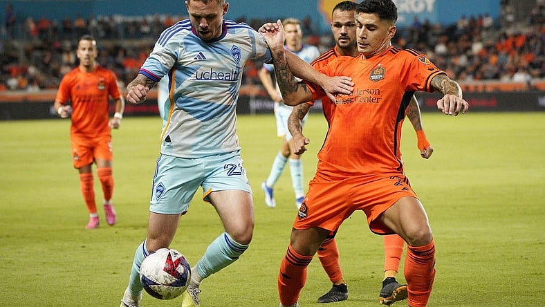 Oct 7, 2023; Houston, Texas, USA; Colorado Rapids midfielder Sam Nicholson (28) dribbles against Houston Dynamo defender Franco Escobar (2) at Shell Energy Stadium. Mandatory Credit: Dustin Safranek-USA TODAY Sports