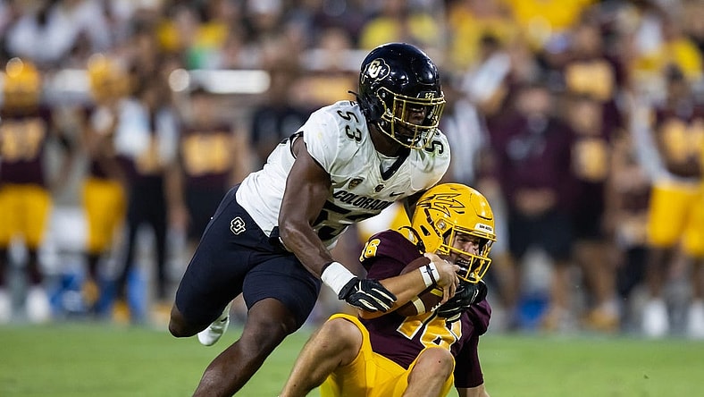 Oct 7, 2023; Tempe, Arizona, USA; Arizona State Sun Devils quarterback Trenton Bourguet (16) is sacked by Colorado Buffaloes defensive end Arden Walker (53) in the second half at Mountain America Stadium. Mandatory Credit: Mark J. Rebilas-USA TODAY Sports