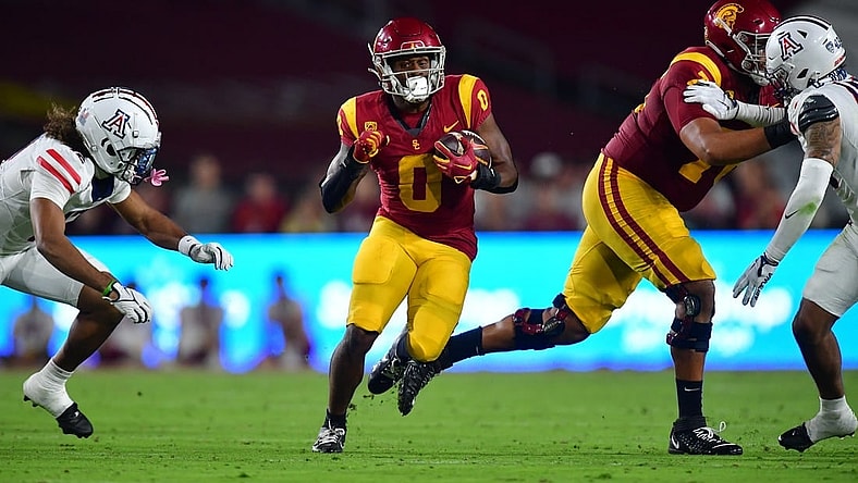 Oct 7, 2023; Los Angeles, California, USA; Southern California Trojans running back MarShawn Lloyd (0) runs the ball against the Arizona Wildcats during the first half at Los Angeles Memorial Coliseum. Mandatory Credit: Gary A. Vasquez-USA TODAY Sports