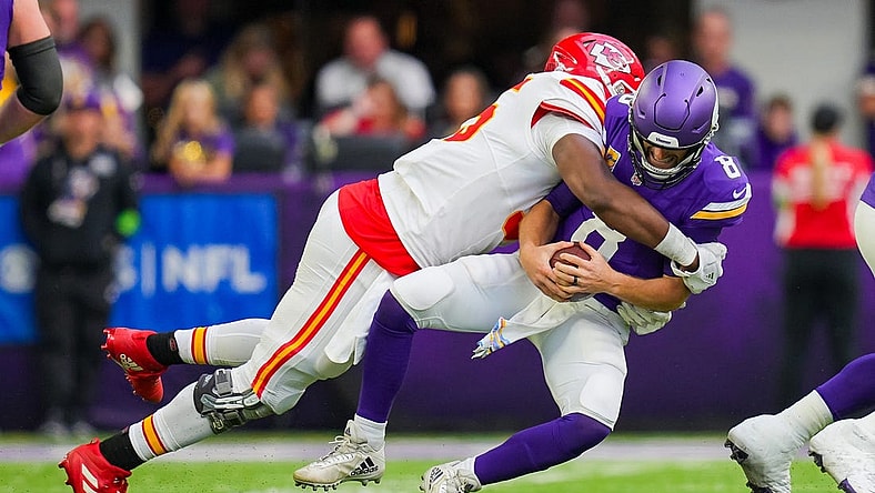 Oct 8, 2023; Minneapolis, Minnesota, USA; Kansas City Chiefs defensive tackle Chris Jones (95) sacks Minnesota Vikings quarterback Kirk Cousins (8) in the second quarter at U.S. Bank Stadium. Mandatory Credit: Brad Rempel-USA TODAY Sports