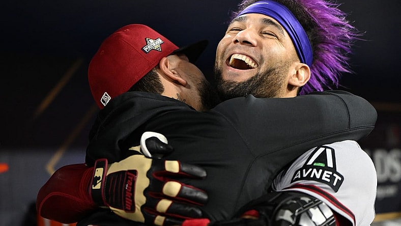 Oct 9, 2023; Los Angeles, California, USA; Arizona Diamondbacks left fielder Lourdes Gurriel Jr. (12) reacts with catcher Jose Herrera (11) after hitting a home run during the sixth inning for game two of the NLDS for the 2023 MLB playoffs at Dodger Stadium. Mandatory Credit: Jayne Kamin-Oncea-USA TODAY Sports