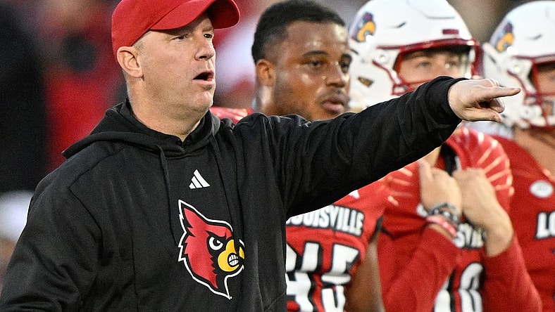 Oct 7, 2023; Louisville, Kentucky, USA;  Louisville Cardinals head coach Jeff Brohm watches his players warm up before facing off against the Notre Dame Fighting at L&N Federal Credit Union Stadium. Louisville defeated Notre Dame 33-20. Mandatory Credit: Jamie Rhodes-USA TODAY Sports