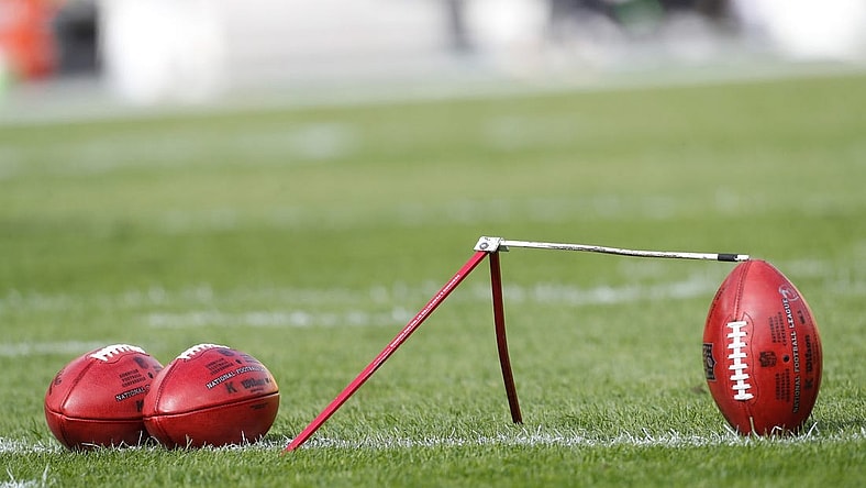 Oct 8, 2023; Pittsburgh, Pennsylvania, USA;  Official NFL game footballs and a kicking tee on the field before the Pittsburgh Steelers host the Baltimore Ravensa at Acrisure Stadium. Mandatory Credit: Charles LeClaire-USA TODAY Sports