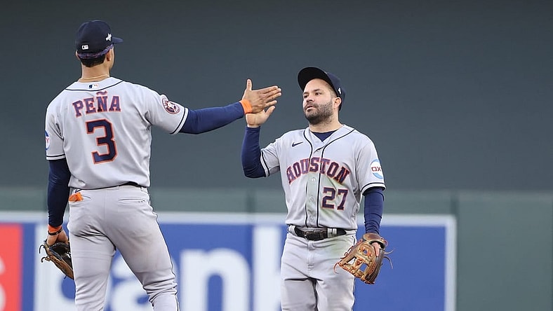 Oct 10, 2023; Minneapolis, Minnesota, USA; Houston Astros second baseman Jose Altuve (27) and shortstop Jeremy Pena (3) celebrates defeating Minnesota Twins  during game three of the ALDS for the 2023 MLB playoffs at Target Field. Mandatory Credit: Jesse Johnson-USA TODAY Sports