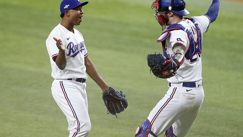 Oct 10, 2023; Arlington, Texas, USA; Texas Rangers relief pitcher Jose Leclerc (25) and catcher Jonah Heim (28) celebrate after defeating the Baltimore Orioles in game three of the ALDS for the 2023 MLB playoffs at Globe Life Field. Mandatory Credit: Andrew Dieb-USA TODAY Sports
