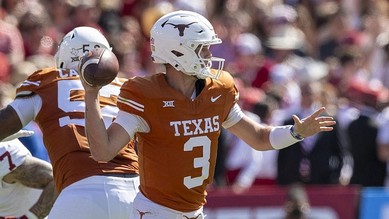 Oct 7, 2023; Dallas, Texas, USA; Texas Longhorns quarterback Quinn Ewers (3) in action during the game between the Texas Longhorns and the Oklahoma Sooners at the Cotton Bowl. Mandatory Credit: Jerome Miron-USA TODAY Sports