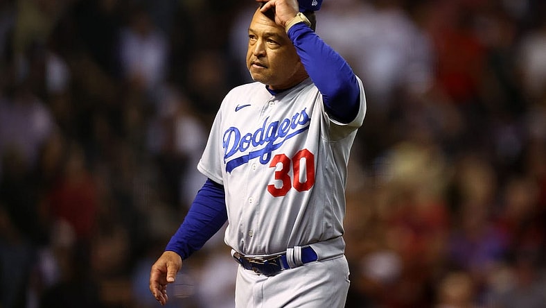 Oct 11, 2023; Phoenix, Arizona, USA; Los Angeles Dodgers manager Dave Roberts (30) reacts in the seventh inning against the Arizona Diamondbacks for game three of the NLDS for the 2023 MLB playoffs at Chase Field. Mandatory Credit: Mark J. Rebilas-USA TODAY Sports