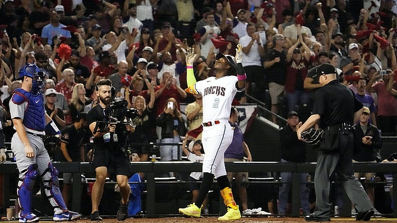 Oct 11, 2023; Phoenix, AZ, USA; Arizona Diamondbacks Geraldo Perdomo (2) reacts after hitting a home run off Los Angeles Dodgers starting pitcher Lance Lynn (35) in the third inning during Game 3 of the NLDS at Chase Field. Mandatory Credit: Rob Schumacher-Arizona Republic