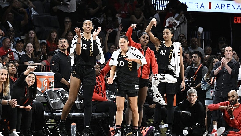 Oct 11, 2023; Las Vegas, Nevada, USA; Las Vegas Aces forward A'ja Wilson (22), guard Kelsey Plum (10), guard Jackie Young (0) and center Kiah Stokes (41) react to a play against the New York Liberty during the second half during game two of the 2023 WNBA Finals at Michelob Ultra Arena. Mandatory Credit: Candice Ward-USA TODAY Sports