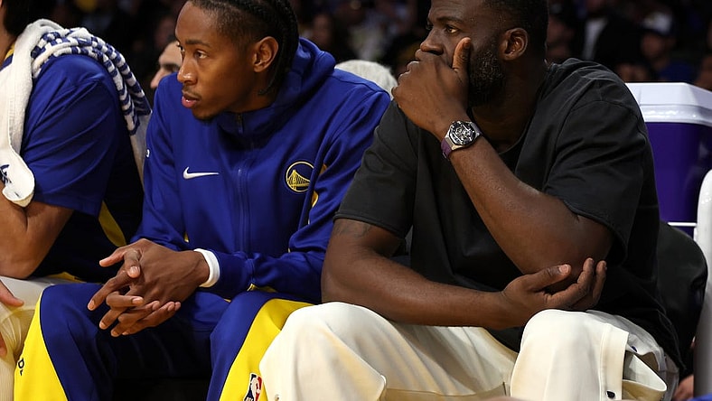 Oct 13, 2023; Los Angeles, California, USA;  Golden State Warriors Draymond Green (right) watches a game against the Los Angeles Lakers at Crypto.com Arena. Mandatory Credit: Kiyoshi Mio-USA TODAY Sports