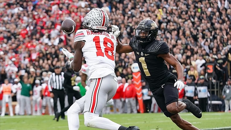 Oct 14, 2023; West Lafayette, Indiana, USA;  Ohio State Buckeyes wide receiver Marvin Harrison Jr. (18) catches a pass for a touchdown against Purdue Boilermakers defensive back Markevious Brown (1) during the first half at Ross-Ade Stadium. Mandatory Credit: Robert Goddin-USA TODAY Sports