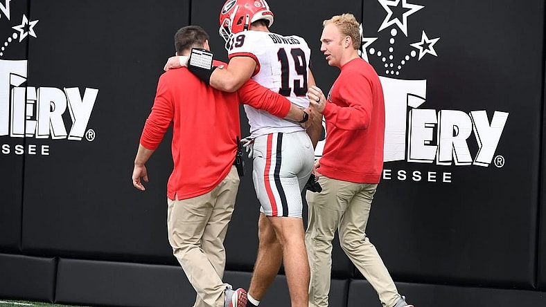 Oct 14, 2023; Nashville, Tennessee, USA; Georgia Bulldogs tight end Brock Bowers (19) walks off the field after an injury during the first half against the Vanderbilt Commodores at FirstBank Stadium. Mandatory Credit: Christopher Hanewinckel-USA TODAY Sports