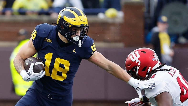Oct 14, 2023; Ann Arbor, Michigan, USA; Michigan Wolverines tight end Colston Loveland (18) runs the ball in the first half against the Indiana Hoosiers at Michigan Stadium. Mandatory Credit: Rick Osentoski-USA TODAY Sports