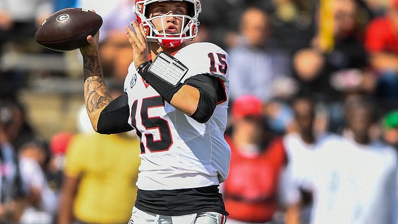Oct 14, 2023; Nashville, Tennessee, USA;  Georgia Bulldogs quarterback Carson Beck (15) throws the ball against the Vanderbilt Commodores during the first half at FirstBank Stadium. Mandatory Credit: Steve Roberts-USA TODAY Sports
