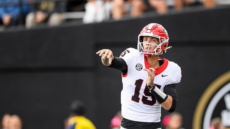 Oct 14, 2023; Nashville, Tennessee, USA;  Georgia Bulldogs quarterback Carson Beck (15) throws a pass against the Vanderbilt Commodores during the second half at FirstBank Stadium. Mandatory Credit: Steve Roberts-USA TODAY Sports