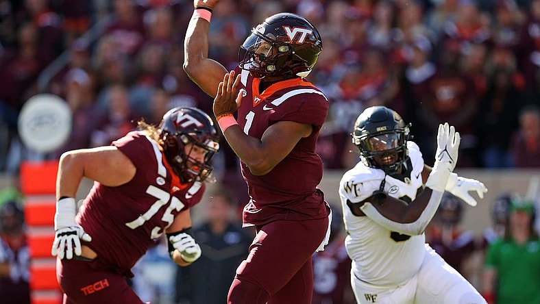 Oct 14, 2023; Blacksburg, Virginia, USA; Virginia Tech Hokies quarterback Kyron Drones (1) throws a pass during the first quarter against the Wake Forest Demon Deacons at Lane Stadium. Mandatory Credit: Peter Casey-USA TODAY Sports