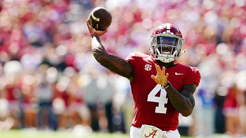 Oct 14, 2023; Tuscaloosa, Alabama, USA; Alabama Crimson Tide quarterback Jalen Milroe (4) rolls out to pass against the Arkansas Razorbacks during the second half at Bryant-Denny Stadium. Mandatory Credit: John David Mercer-USA TODAY Sports