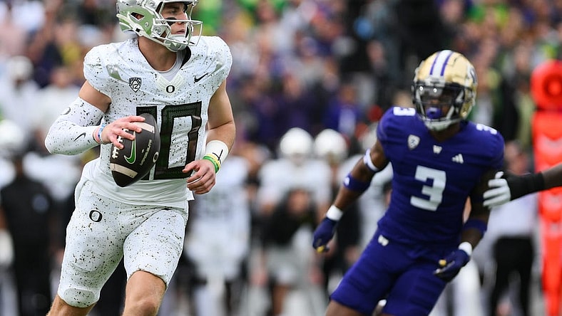 Oct 14, 2023; Seattle, Washington, USA; Oregon Ducks quarterback Bo Nix (10) looks to pass the ball during the first half against the Washington Huskies at Alaska Airlines Field at Husky Stadium. Mandatory Credit: Steven Bisig-USA TODAY Sports