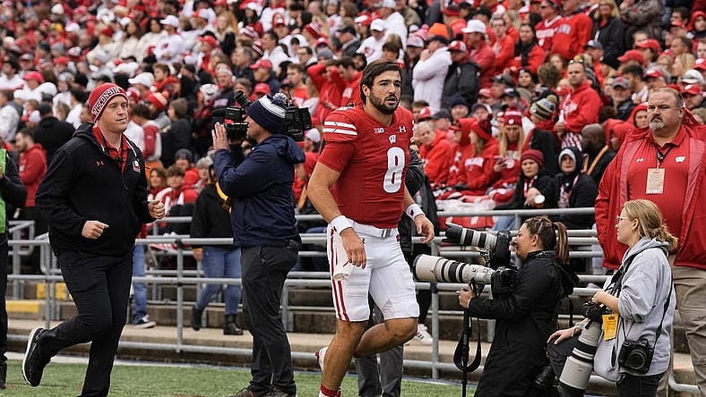 Oct 14, 2023; Madison, Wisconsin, USA;  Wisconsin Badgers quarterback Tanner Mordecai (8) runs to the locker room during the second quarter against the Iowa Hawkeyes at Camp Randall Stadium. Mandatory Credit: Jeff Hanisch-USA TODAY Sports