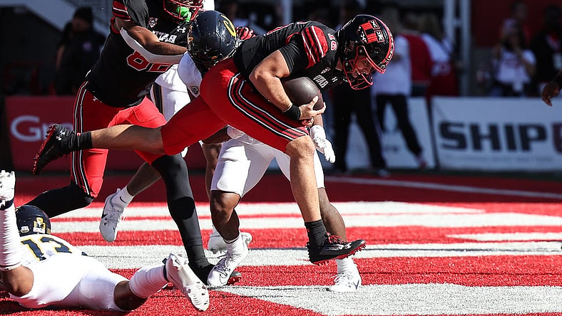 Oct 14, 2023; Salt Lake City, Utah, USA; Utah Utes quarterback Bryson Barnes (16) runs in for a touchdown against the California Golden Bears in the second half at Rice-Eccles Stadium. Mandatory Credit: Rob Gray-USA TODAY Sports