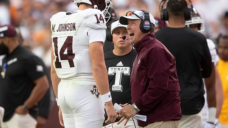 Oct 14, 2023; Knoxville, TN, USA; Texas A&M quarterback Max Johnson (14) talks with Texas A&M head coach Jimbo Fisher during a football game between Tennessee and Texas A&M at Neyland Stadium in Knoxville, Tenn., on Saturday, Oct. 14, 2023. Mandatory Credit: Brianna Paciorka-USA TODAY Sports