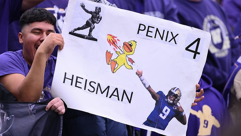 Oct 14, 2023; Seattle, Washington, USA; Fans hold up a Michael Penix Jr. (9) (not pictured) sign during the second half of the game between the Washington Huskies and the Oregon Ducks at Alaska Airlines Field at Husky Stadium. Mandatory Credit: Steven Bisig-USA TODAY Sports