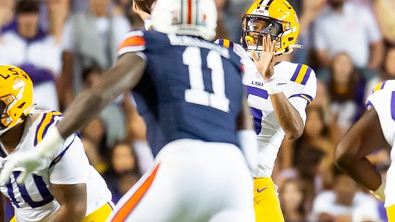 LSU quarterback Jayden Daniels 5 throws a pass as the LSU Tigers take on the Auburn Tigers at Tiger Stadium in Baton Rouge, Louisiana, Saturday, Oct. 14, 2023.
