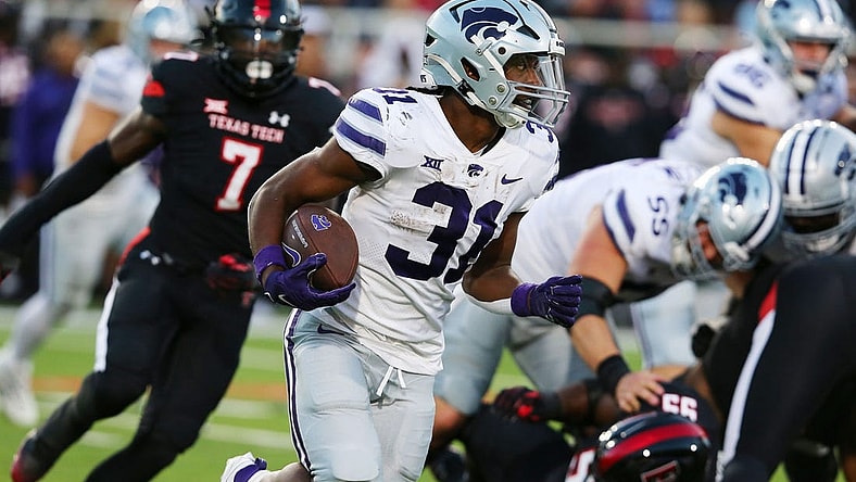 Oct 14, 2023; Lubbock, Texas, USA;  Kansas State Wildcats running back Dj Giddens (31) rushes against the Texas Tech Red Raiders in the first half at Jones AT&T Stadium and Cody Campbell Field. Mandatory Credit: Michael C. Johnson-USA TODAY Sports