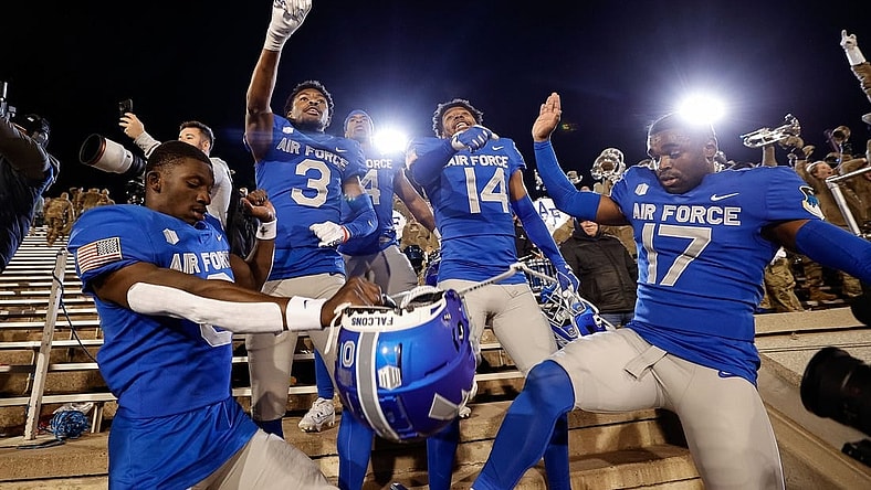 Oct 14, 2023; Colorado Springs, Colorado, USA; Air Force Falcons defensive back Trey Williams (0) and defensive back Jamari Bellamy (3) and fullback Emmanuel Michel (4) and defensive back K.C. Beard (14) and cornerback Zion Kelly (17) celebrate after the game against the Wyoming Cowboys at Falcon Stadium. Mandatory Credit: Isaiah J. Downing-USA TODAY Sports