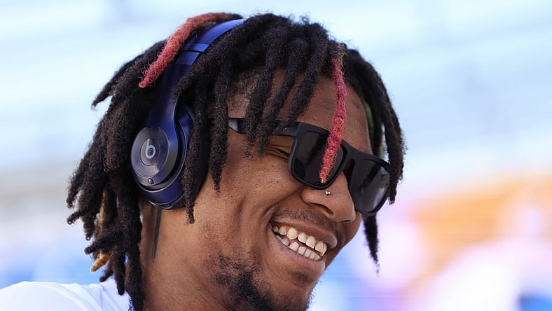 Indianapolis Colts quarterback Anthony Richardson (5) smiles while signing autographs before an NFL football matchup against the Jacksonville Jaguars Sunday, Oct. 15, 2023 at EverBank Stadium in Jacksonville, Fla. Richardson is on injured reserve after suffering a shoulder injury in week 5 against the Tennessee Titans. [Corey Perrine/Florida Times-Union]