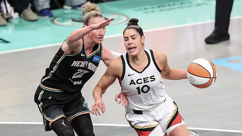 Oct 15, 2023; Brooklyn, New York, USA; Las Vegas Aces guard Kelsey Plum (10) drives around New York Liberty guard Courtney Vandersloot (22) in the first quarter during game three of the 2023 WNBA Finals at Barclays Center. Mandatory Credit: Wendell Cruz-USA TODAY Sports