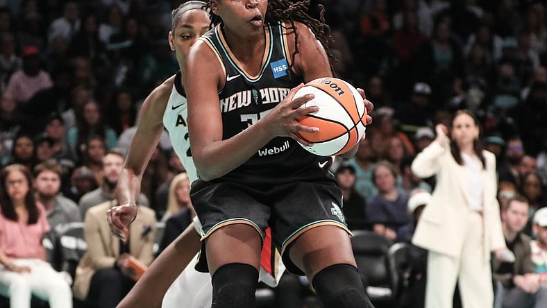 Oct 15, 2023; Brooklyn, New York, USA; New York Liberty forward Jonquel Jones (35) grabs a rebound against the Las Vegas Aces in the second quarter during game three of the 2023 WNBA Finals at Barclays Center. Mandatory Credit: Wendell Cruz-USA TODAY Sports