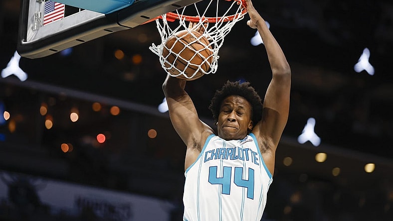 Oct 15, 2023; Charlotte, North Carolina, USA; Charlotte Hornets center Nick Richards Charlotte Hornets guard Frank Ntilikina (44) dunks against the Oklahoma City Thunder in the second half at Spectrum Center. Mandatory Credit: Nell Redmond-USA TODAY Sports
