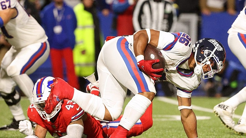 New York Giants running back Saquon Barkley (26) regains his balance on this run against the Bills.