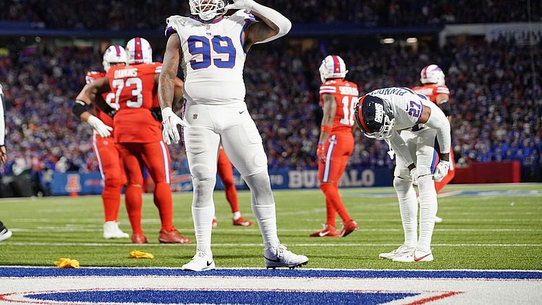 Oct 15, 2023; Orchard Park, New York, USA; New York Giants defensive end Leonard Williams (99) lets the crowd know he can   t hear them during the second half against the Buffalo Bills at Highmark Stadium. Mandatory Credit: Gregory Fisher-USA TODAY Sports
