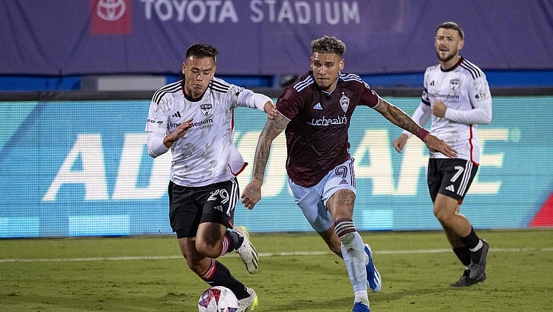 Oct 14, 2023; Frisco, TX, USA; Colorado Rapids forward Rafael Navarro (9) and FC Dallas defender Sam Junqua (29) in action in front of Advocare signage during the game between FC Dallas and the Colorado Rapids at Toyota Stadium. Mandatory Credit: Jerome Miron-USA TODAY Sports