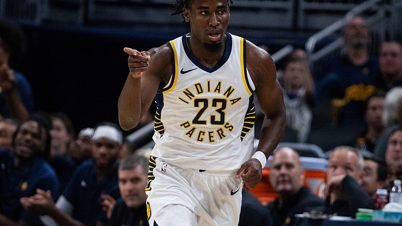 Oct 16, 2023; Indianapolis, Indiana, USA; Indiana Pacers forward Aaron Nesmith (23) celebrates a made three point basket in the second quarter against the Atlanta Hawks at Gainbridge Fieldhouse. Mandatory Credit: Trevor Ruszkowski-USA TODAY Sports