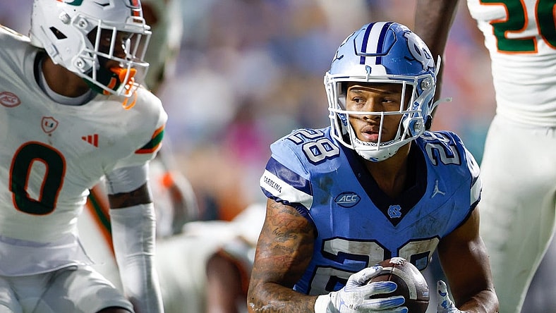Oct 14, 2023; Chapel Hill, North Carolina, USA; North Carolina Tar Heels running back Omarion Hampton (28) after a run against the Miami Hurricanes in the second half at Kenan Memorial Stadium. Mandatory Credit: Nell Redmond-USA TODAY Sports