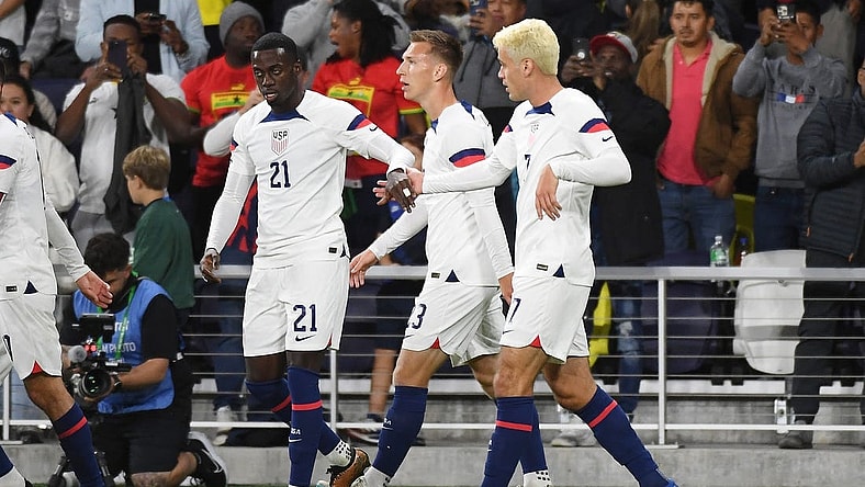 Oct 17, 2023; Nashville, Tennessee, USA; United States forward Tim Weah (21) celebrates with midfielder Gio Reyna (7) after a goal during the first half against Ghana at GEODIS Park. Mandatory Credit: Christopher Hanewinckel-USA TODAY Sports