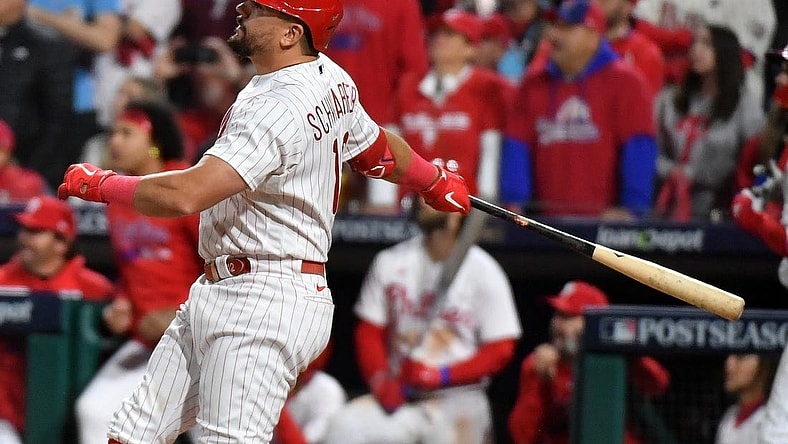 Oct 17, 2023; Philadelphia, Pennsylvania, USA; Philadelphia Phillies left fielder Kyle Schwarber (12) hits a home run against the Arizona Diamondbacks during the sixth inning for game two of the NLCS for the 2023 MLB playoffs at Citizens Bank Park. Mandatory Credit: Eric Hartline-USA TODAY Sports