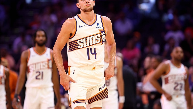 Oct 10, 2023; Phoenix, Arizona, USA; Phoenix Suns forward Drew Eubanks (14) against the Denver Nuggets during a preseason game at Footprint Center. Mandatory Credit: Mark J. Rebilas-USA TODAY Sports
