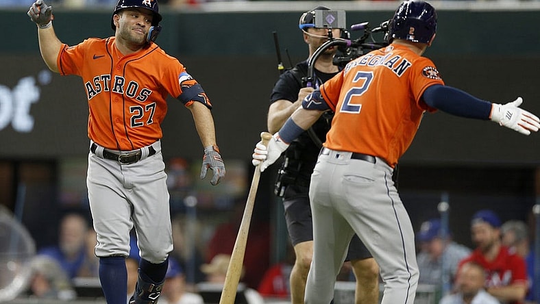 Oct 18, 2023; Arlington, Texas, USA; Houston Astros second baseman Jose Altuve (27) celebrates with third baseman Alex Bregman (2) after a solo home run during the third inning of game three of the ALCS against the Texas Rangers in the 2023 MLB playoffs at Globe Life Field. Mandatory Credit: Andrew Dieb-USA TODAY Sports