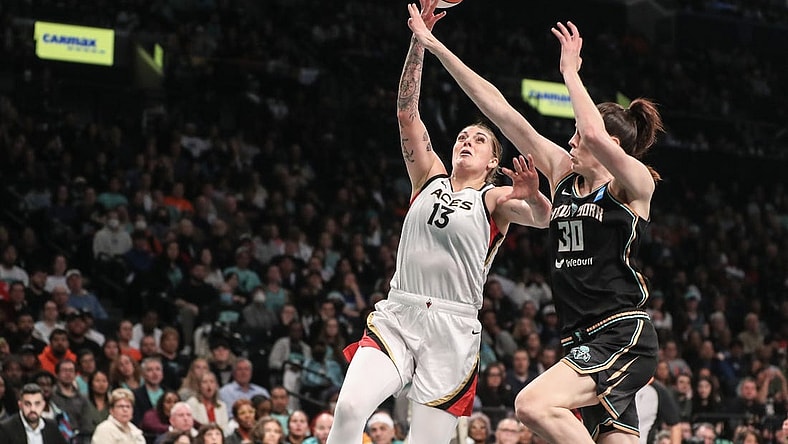 Oct 18, 2023; Brooklyn, New York, USA; Las Vegas Aces forward Cayla George (13) drives past New York Liberty forward Breanna Stewart (30) in the second quarter during game four of the 2023 WNBA Finals at Barclays Center. Mandatory Credit: Wendell Cruz-USA TODAY Sports