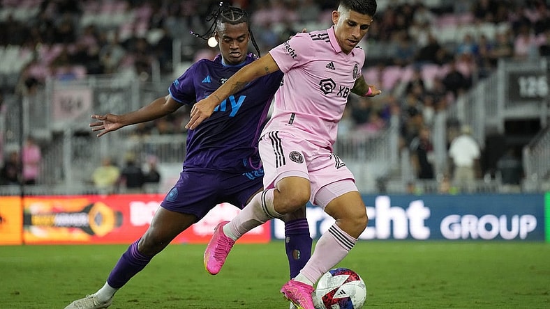 Oct 18, 2023; Fort Lauderdale, Florida, USA; Inter Miami forward Nicolas Stefanelli (22) moves the ball against Charlotte FC forward Kerwin Vargas (18) during the first half at DRV PNK Stadium. Mandatory Credit: Jim Rassol-USA TODAY Sports