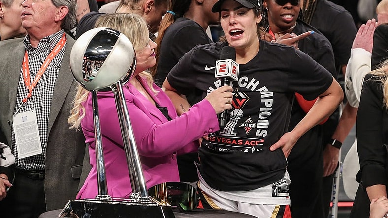 Oct 18, 2023; Brooklyn, New York, USA; Las Vegas Aces guard Kelsey Plum (10) is interviewed by ESPN reporter Holly Rowe after defeating the New York Liberty to win the 2023 WNBA Finals at Barclays Center. Mandatory Credit: Wendell Cruz-USA TODAY Sports