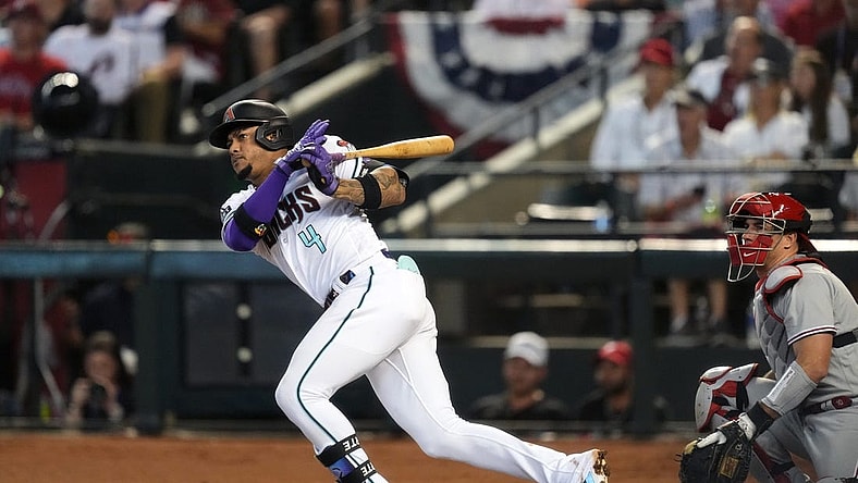 Arizona Diamondbacks second baseman Ketel Marte (4) hits double during the third inning against the Philadelphia Phillies in game three of the NLCS of the 2023 MLB playoffs at Chase Field in Phoenix on Oct. 19, 2023.
